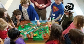 kids learning about stormwater pollution with enviroscape
