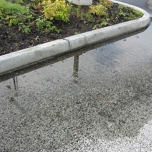 Standing water on permeable pavement.