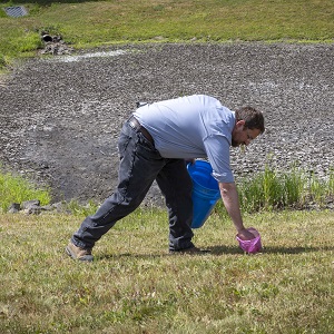 person pet waste scooping 