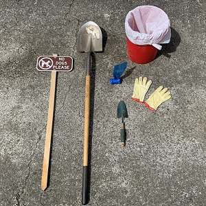 pet waste tools include gloves, shovel, bucket and signage,