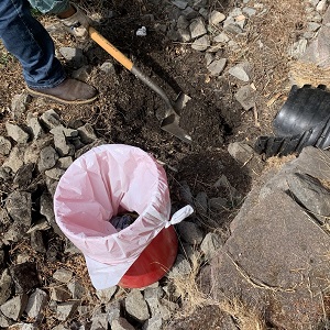 removing sediment from under riprap