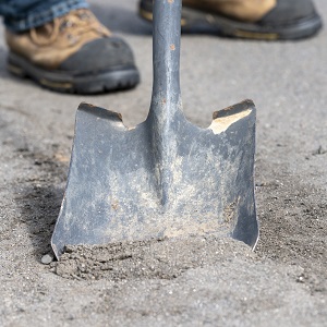 shoveling dirt from sediment trap 
