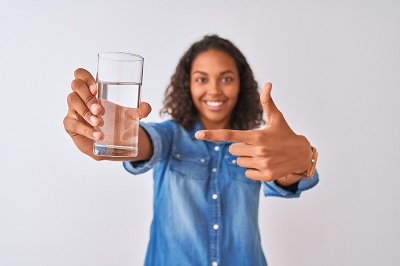 women pointing to water glass 400px.jpg